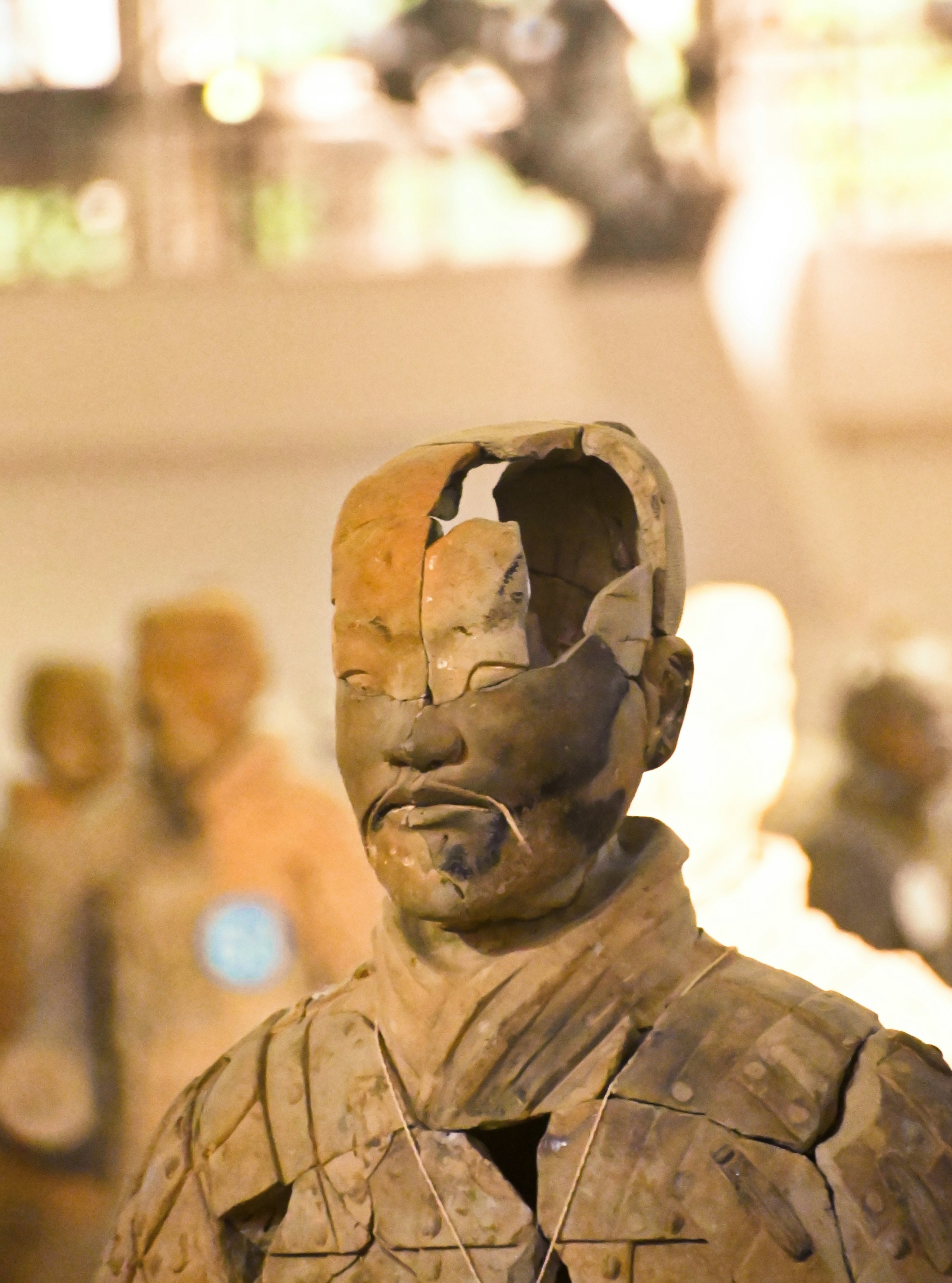 brown concrete statue of man wearing sunglasses